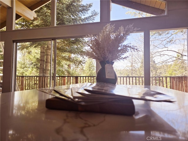 sunroom with beamed ceiling