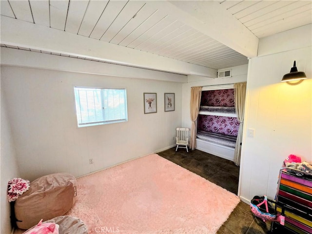 bedroom featuring wood ceiling, radiator heating unit, visible vents, and beamed ceiling
