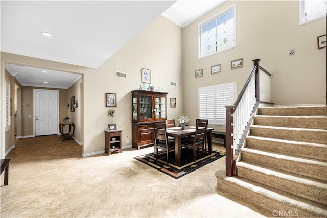 3274 Rural Ln, Corona, CA 92882 - dining room with crown molding, stairway, baseboards, a high ceiling, and visible vents