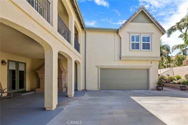 3274 Rural Ln, Corona, CA 92882 - exterior space with stucco siding, an attached garage, french doors, and driveway