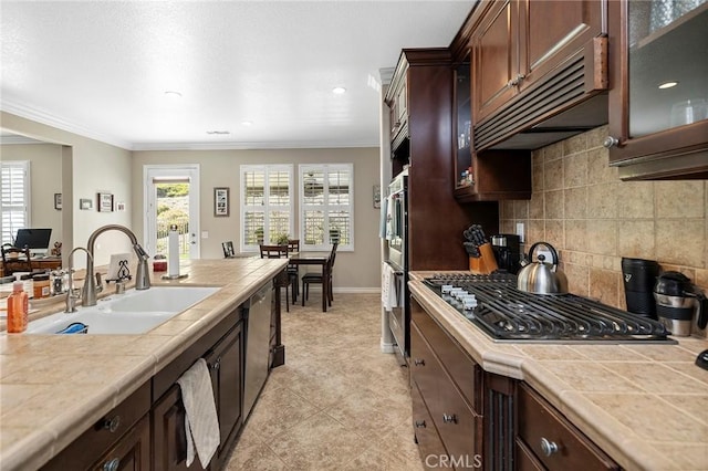 3274 Rural Ln, Corona, CA 92882 - kitchen with tile countertops, crown molding, a sink, and stainless steel appliances