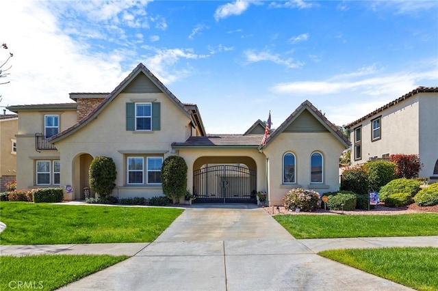 3274 Rural Ln, Corona, CA 92882 - view of front of property featuring a gate, a tiled roof, stucco siding, a front lawn, and driveway
