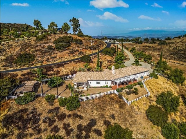 birds eye view of property featuring a mountain view
