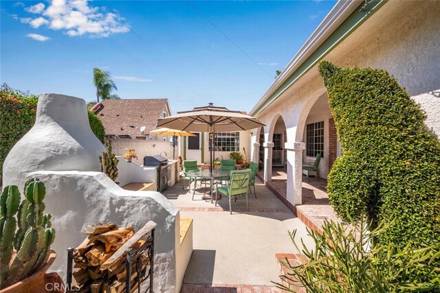 view of patio featuring exterior kitchen