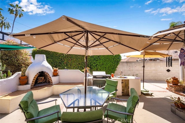 view of patio featuring outdoor dining area, an outdoor living space with a fireplace, fence, and area for grilling