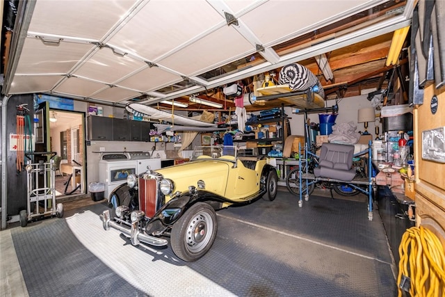 garage featuring washing machine and dryer
