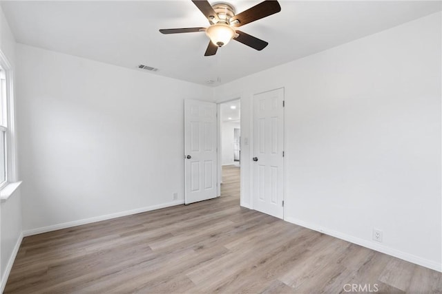 6010 S Verdun Ave, Los Angeles, CA 90043 - empty room featuring wood finished floors, baseboards, and a ceiling fan