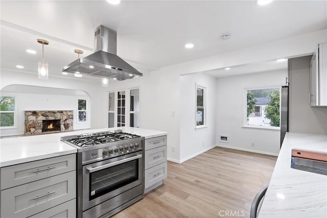 6010 S Verdun Ave, Los Angeles, CA 90043 - kitchen with stainless steel appliances, island range hood, gray cabinets, light wood-type flooring, and recessed lighting
