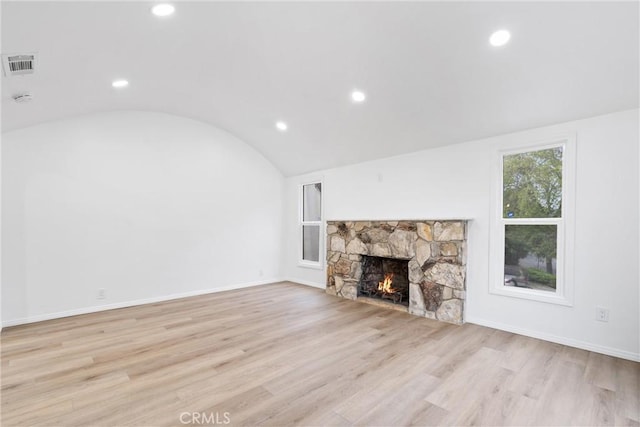 6010 S Verdun Ave, Los Angeles, CA 90043 - unfurnished living room with vaulted ceiling, a fireplace, light wood finished floors, recessed lighting, and baseboards