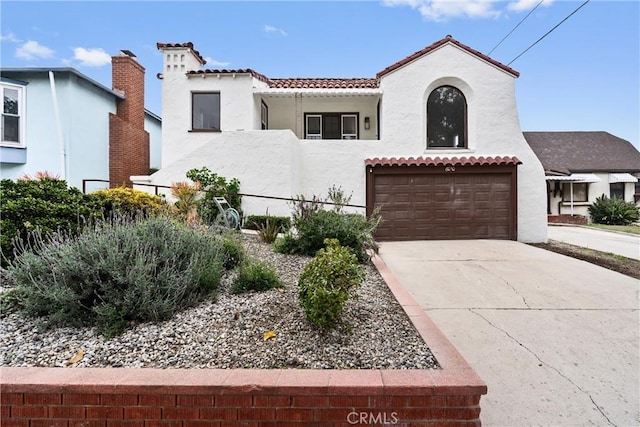 6010 S Verdun Ave, Los Angeles, CA 90043 - mediterranean / spanish-style house featuring stucco siding, a tile roof, a garage, driveway, and fence