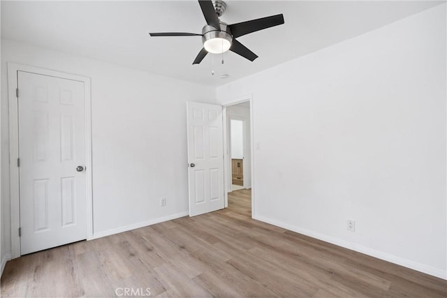 6010 S Verdun Ave, Los Angeles, CA 90043 - unfurnished bedroom with wood finished floors, baseboards, and ceiling fan