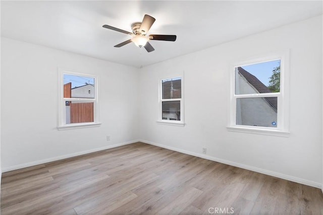 6010 S Verdun Ave, Los Angeles, CA 90043 - spare room with light wood-type flooring, baseboards, and ceiling fan