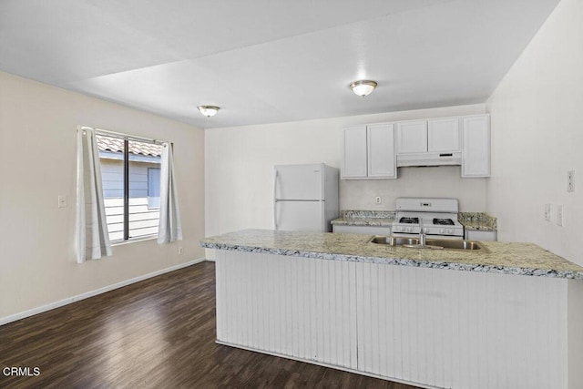 kitchen with white cabinets, white appliances, baseboards, under cabinet range hood, and dark wood-style floors