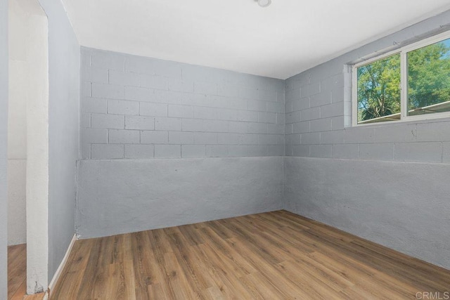 unfurnished room with wood finished floors