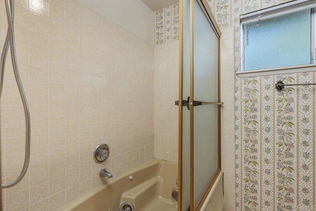 full bathroom with wallpapered walls and tub / shower combination