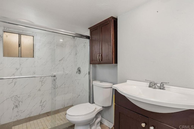 bathroom with a marble finish shower, toilet, and vanity