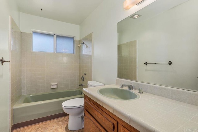 bathroom featuring toilet, bathing tub / shower combination, and vanity