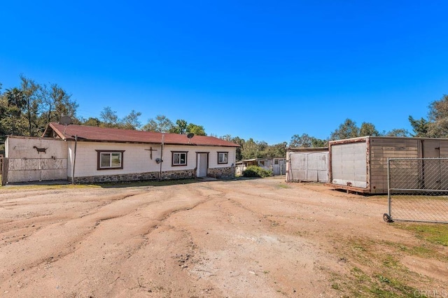 view of front of house with fence