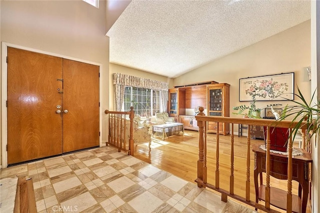 1135 Summitridge Dr, Diamond Bar, CA 91765 - foyer with a textured ceiling, vaulted ceiling, and light floors