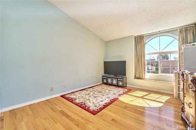 1135 Summitridge Dr, Diamond Bar, CA 91765 - living room featuring a textured ceiling, baseboards, and wood finished floors