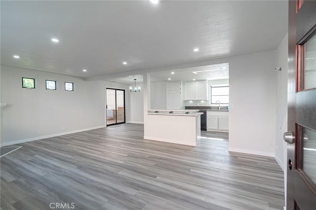 4706 W 168th St, Lawndale, CA 90260 - unfurnished living room featuring a chandelier, recessed lighting, and wood finished floors
