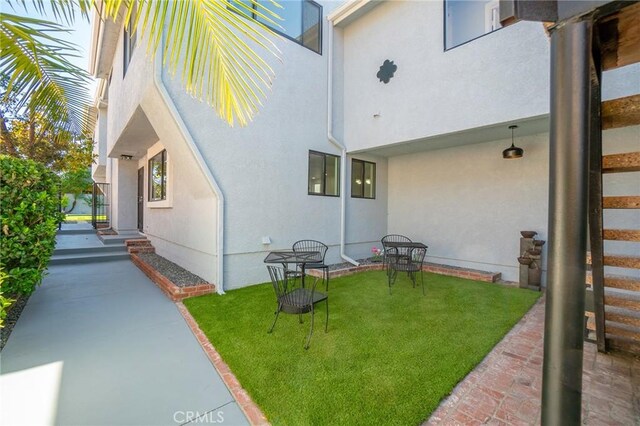 4706 W 168th St, Lawndale, CA 90260 - entrance to property with stucco siding, a yard, and a patio