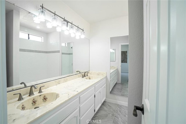 4706 W 168th St, Lawndale, CA 90260 - bathroom with walk in shower, marble finish flooring, and double vanity