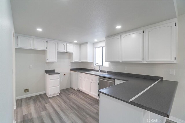 4706 W 168th St, Lawndale, CA 90260 - kitchen with dark countertops, white cabinetry, a peninsula, dishwasher, and recessed lighting