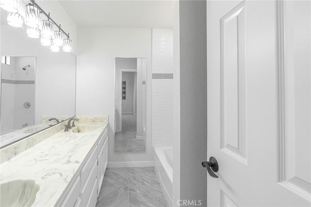 4706 W 168th St, Lawndale, CA 90260 - full bathroom featuring double vanity, marble look tiles, and tub / shower combination