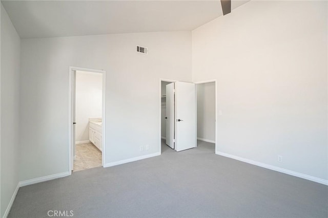 4706 W 168th St, Lawndale, CA 90260 - unfurnished bedroom with a walk in closet, light colored carpet, high vaulted ceiling, connected bathroom, and a closet