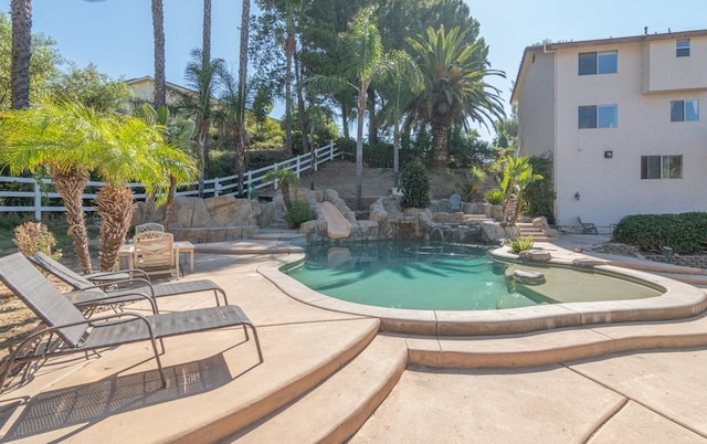 view of pool featuring a fenced in pool, a patio, and fence