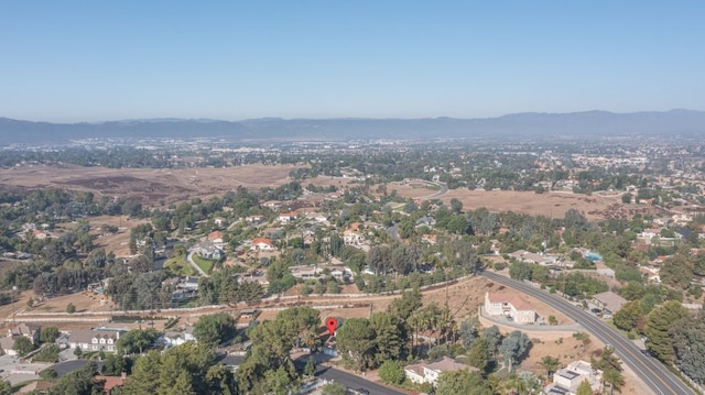 drone / aerial view featuring a mountain view