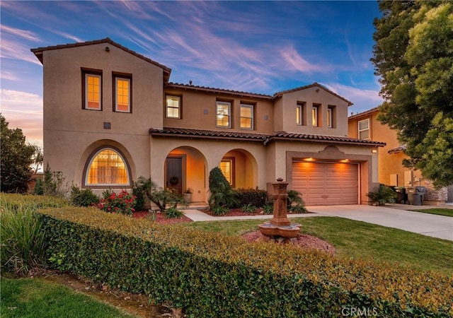 16720 S Peak Ct, Riverside, CA 92503 - mediterranean / spanish-style home with stucco siding, concrete driveway, an attached garage, and a tiled roof