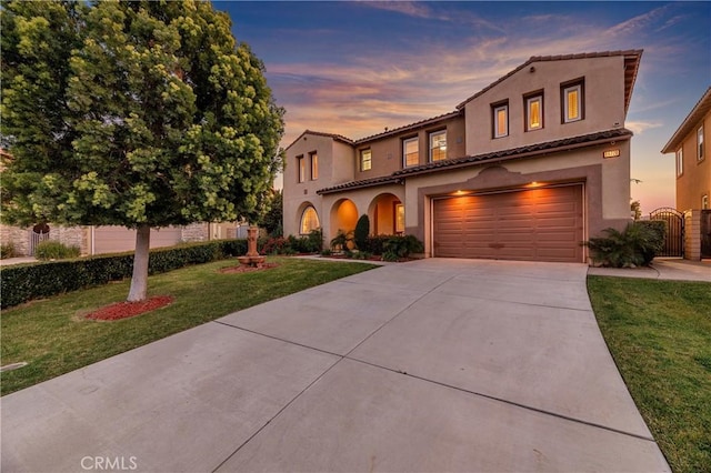 16720 S Peak Ct, Riverside, CA 92503 - mediterranean / spanish home featuring concrete driveway, an attached garage, stucco siding, and a gate