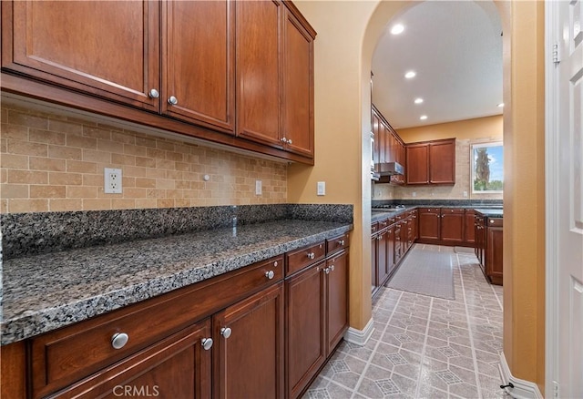 16720 S Peak Ct, Riverside, CA 92503 - kitchen featuring arched walkways, decorative backsplash, stainless steel gas stovetop, recessed lighting, and light tile patterned floors