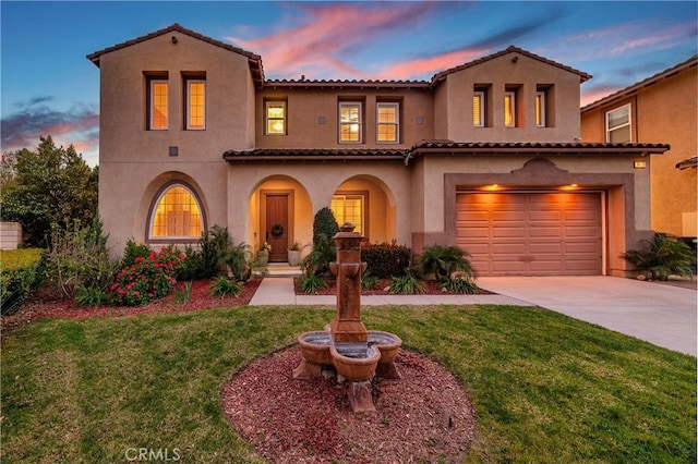 16720 S Peak Ct, Riverside, CA 92503 - mediterranean / spanish home with concrete driveway, a tile roof, an attached garage, stucco siding, and a front lawn
