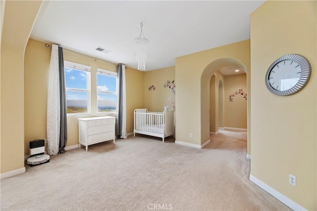 16720 S Peak Ct, Riverside, CA 92503 - bedroom with arched walkways, carpet flooring, and a nursery area