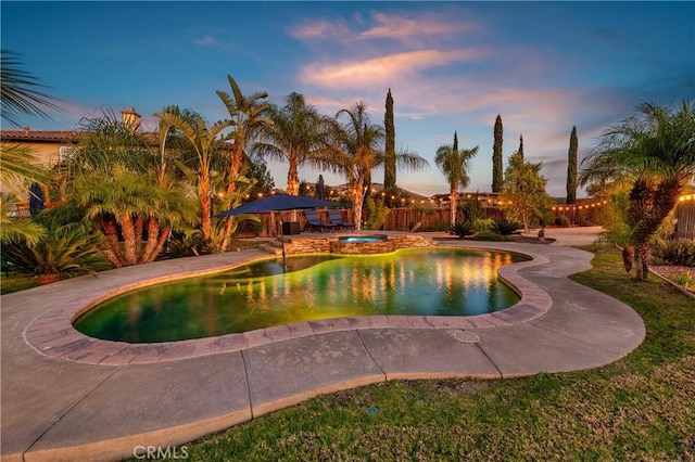 16720 S Peak Ct, Riverside, CA 92503 - pool at dusk with a patio area and a pool with connected hot tub