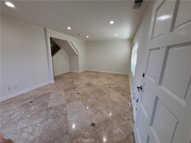 interior space with baseboards, recessed lighting, and visible vents