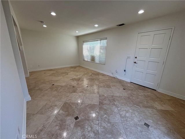 spare room featuring visible vents, recessed lighting, baseboards, and light tile patterned floors