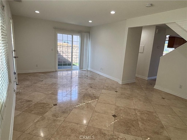 empty room with baseboards, recessed lighting, and tile patterned flooring