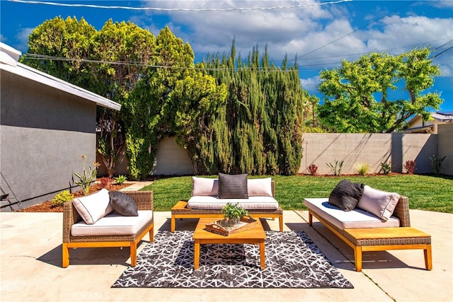 view of patio featuring outdoor lounge area and a fenced backyard