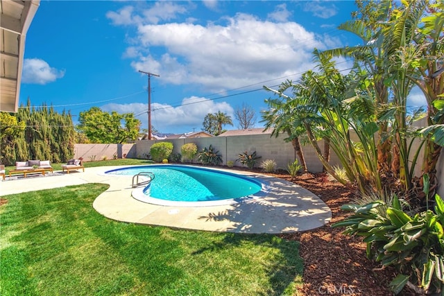 view of pool featuring a lawn, a patio, a fenced in pool, and a fenced backyard