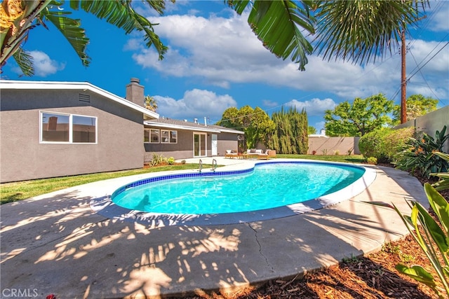 view of pool with a patio, a fenced in pool, and a fenced backyard