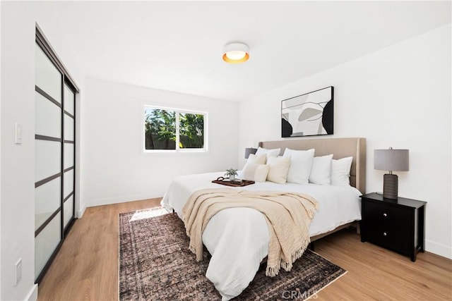 bedroom with light wood-type flooring