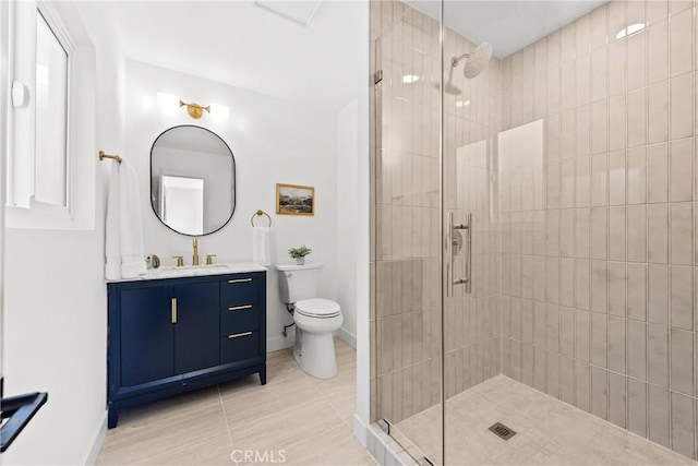 bathroom with baseboards, tiled shower, and toilet