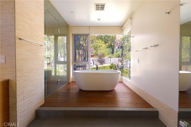 712 Orange Grove Ter, South Pasadena, CA 91030 - bathroom with a freestanding bath, plenty of natural light, and wood finished floors