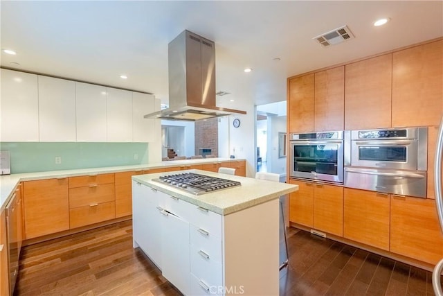 712 Orange Grove Ter, South Pasadena, CA 91030 - kitchen featuring appliances with stainless steel finishes, a warming drawer, island exhaust hood, modern cabinets, and light countertops