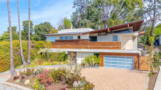 712 Orange Grove Ter, South Pasadena, CA 91030 - contemporary house featuring a garage, stucco siding, and decorative driveway