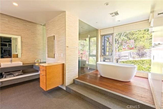 712 Orange Grove Ter, South Pasadena, CA 91030 - full bathroom with a soaking tub, vanity, healthy amount of natural light, and recessed lighting